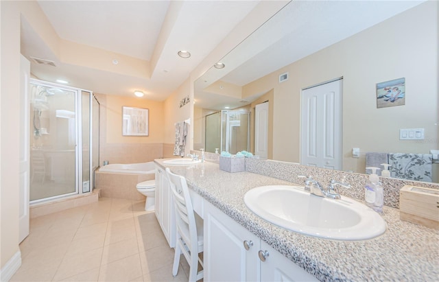 full bathroom featuring tile patterned flooring, shower with separate bathtub, vanity, and toilet