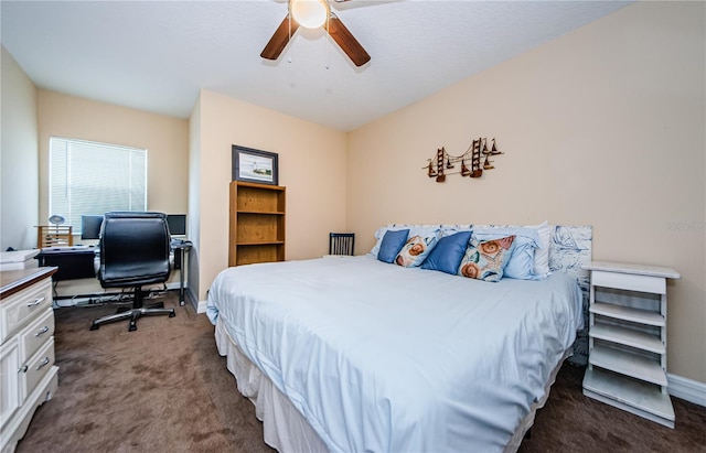 bedroom featuring dark colored carpet and ceiling fan