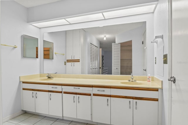 bathroom featuring tile patterned flooring and vanity