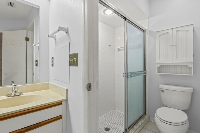 bathroom featuring vanity, an enclosed shower, tile patterned floors, and toilet