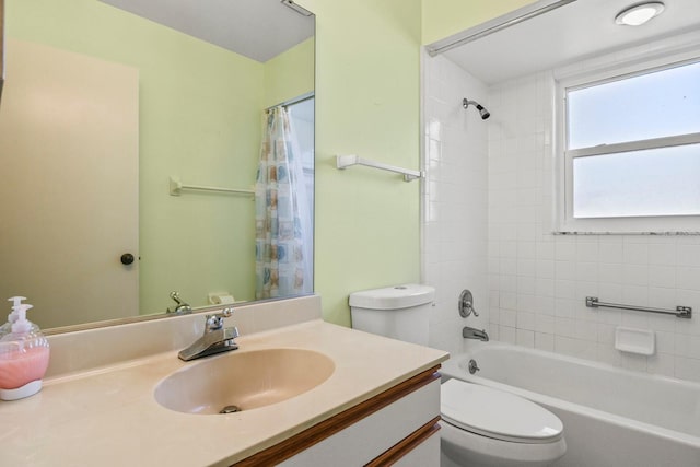 full bathroom with vanity, shower / bath combo with shower curtain, and toilet