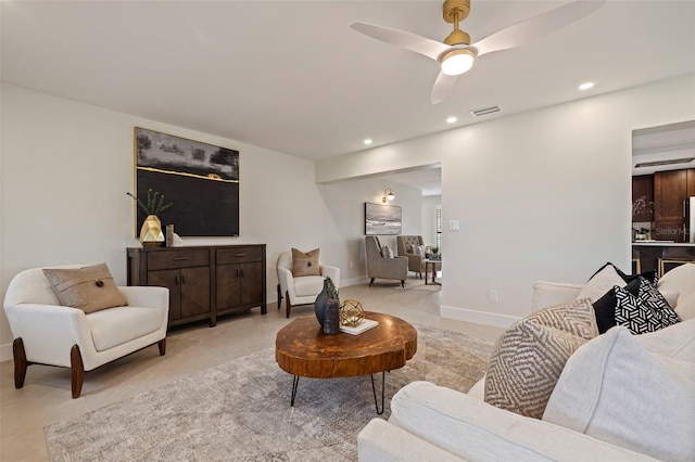 living room featuring light tile patterned flooring and ceiling fan