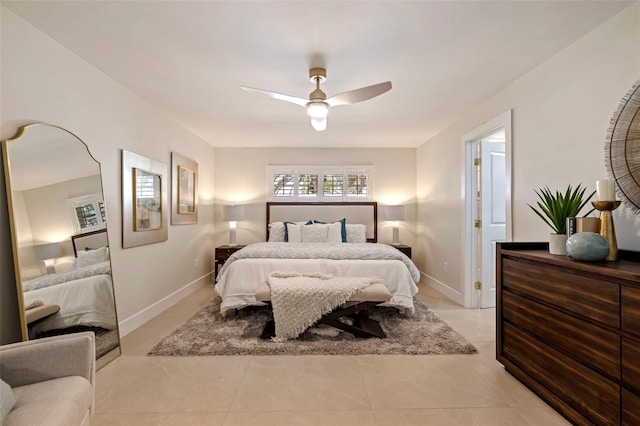 tiled bedroom featuring ceiling fan