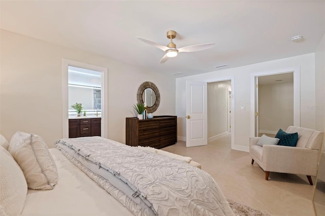 bedroom featuring ceiling fan and ensuite bath