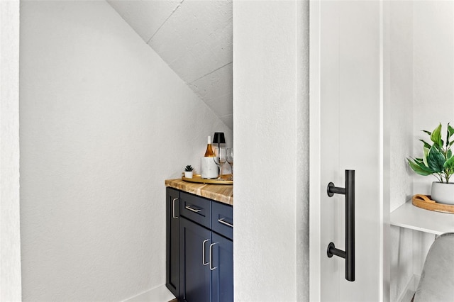 bathroom with vaulted ceiling