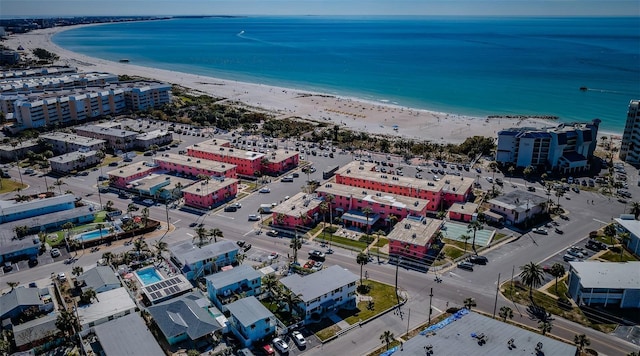 bird's eye view featuring a view of the beach and a water view