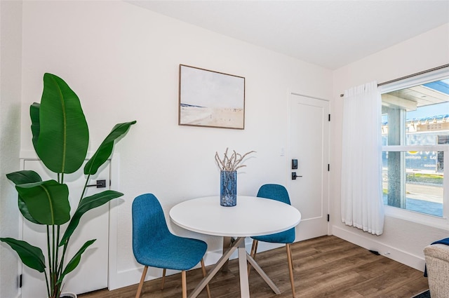 dining area featuring wood-type flooring