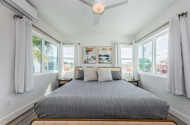 bedroom with multiple windows and ceiling fan