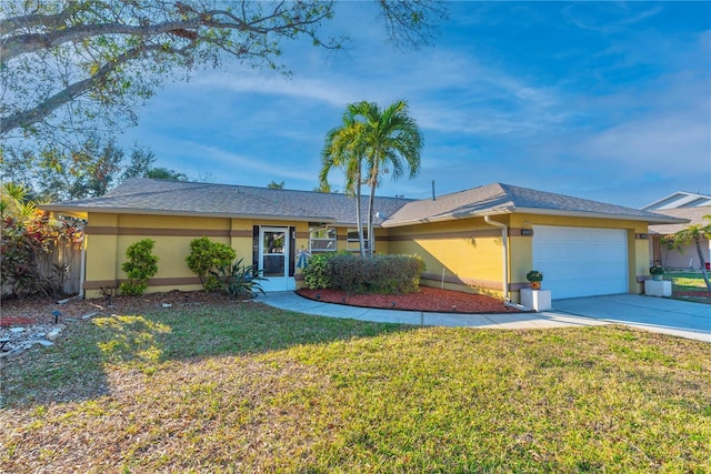 ranch-style home with a garage and a front lawn