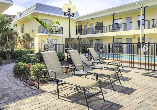 view of patio / terrace featuring a community pool