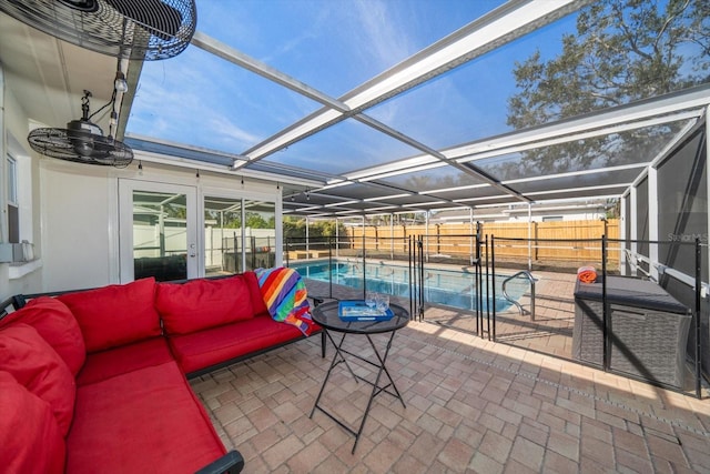 view of patio / terrace featuring outdoor lounge area, a lanai, a fenced backyard, and a fenced in pool