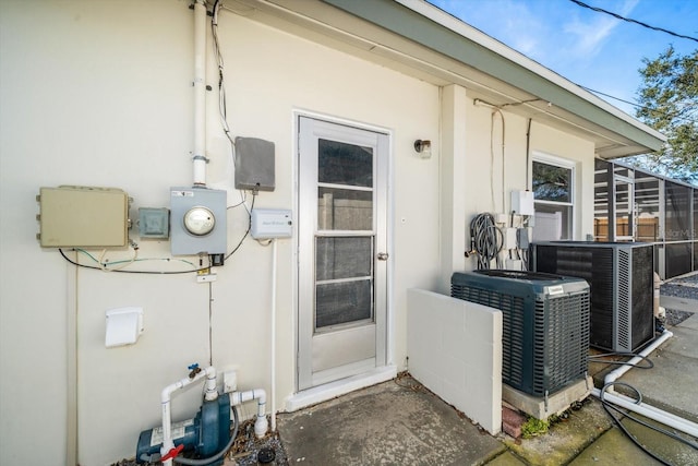 doorway to property with central air condition unit