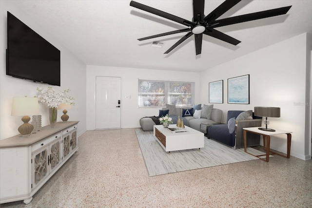 living room with visible vents, light speckled floor, and a ceiling fan