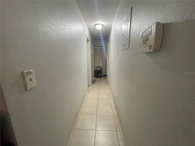 corridor with light tile patterned floors