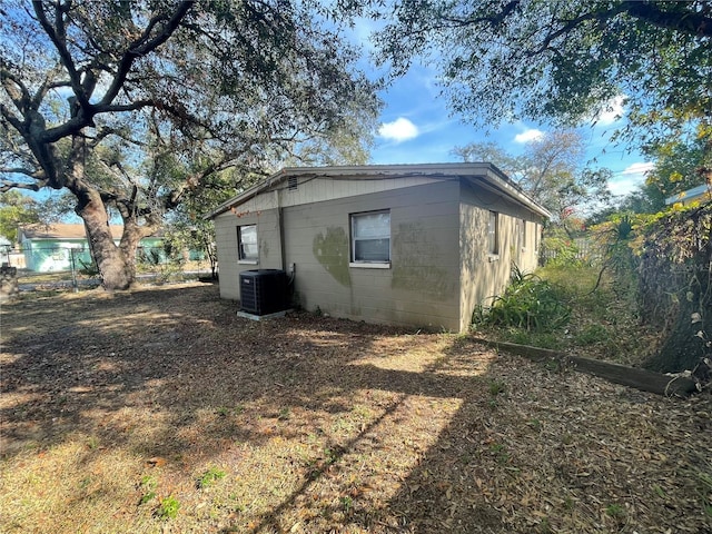 view of side of property with central AC