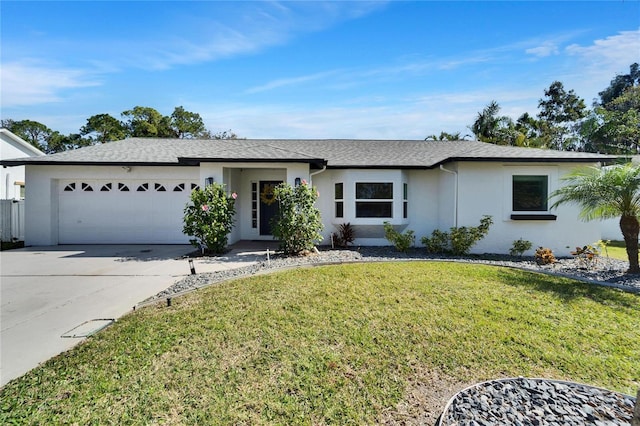 ranch-style home with a garage and a front lawn