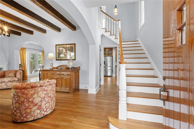 6010 17th Ave S, Gulfport, FL 33707 - foyer entrance featuring beam ceiling and light hardwood / wood-style floors