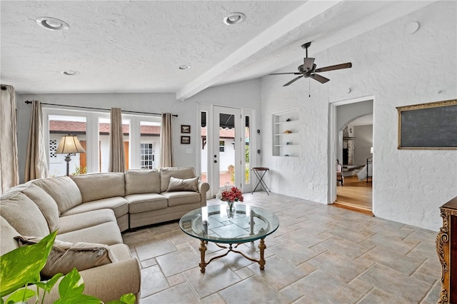 6010 17th Ave S, Gulfport, FL 33707 - living room with vaulted ceiling with beams, french doors, a textured ceiling, and ceiling fan