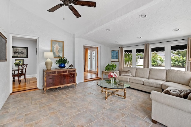 6010 17th Ave S, Gulfport, FL 33707 - living room with lofted ceiling, ceiling fan, and a textured ceiling