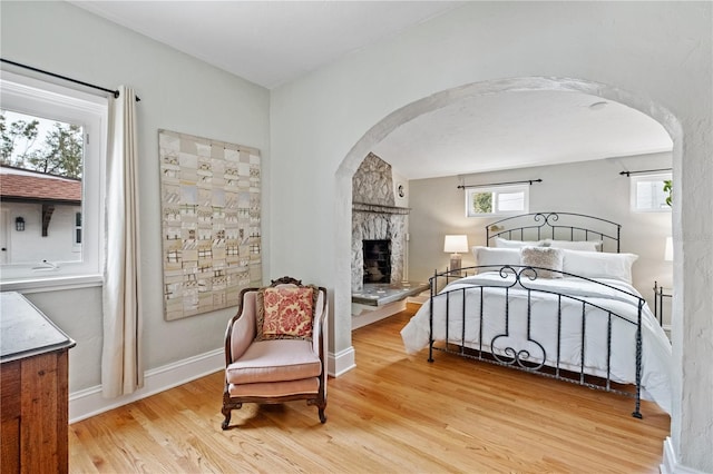 6010 17th Ave S, Gulfport, FL 33707 - bedroom featuring a fireplace and light hardwood / wood-style floors