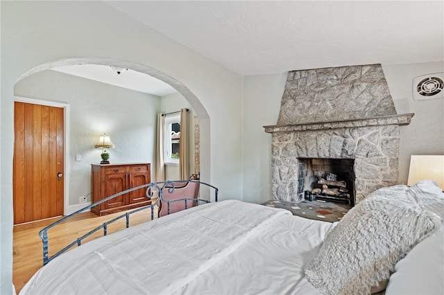 6010 17th Ave S, Gulfport, FL 33707 - bedroom with a fireplace and wood-type flooring
