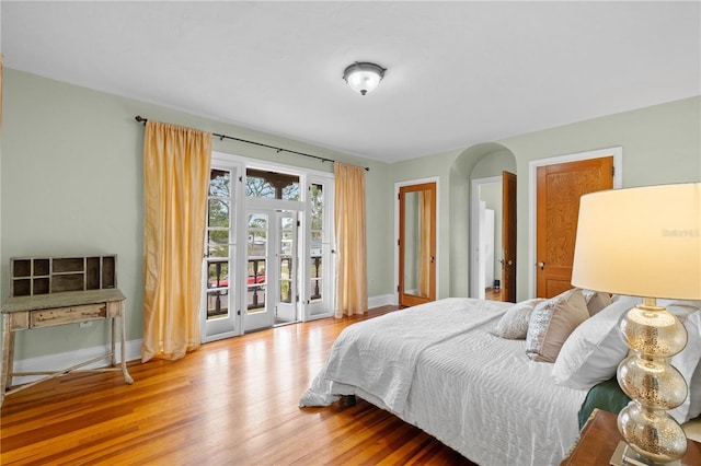 6010 17th Ave S, Gulfport, FL 33707 - bedroom with access to exterior and wood-type flooring