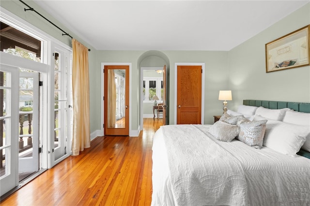6010 17th Ave S, Gulfport, FL 33707 - bedroom with access to outside and light hardwood / wood-style flooring