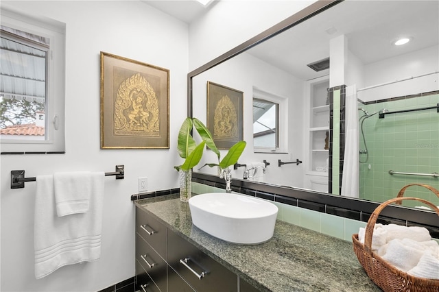 6010 17th Ave S, Gulfport, FL 33707 - bathroom featuring vanity and walk in shower