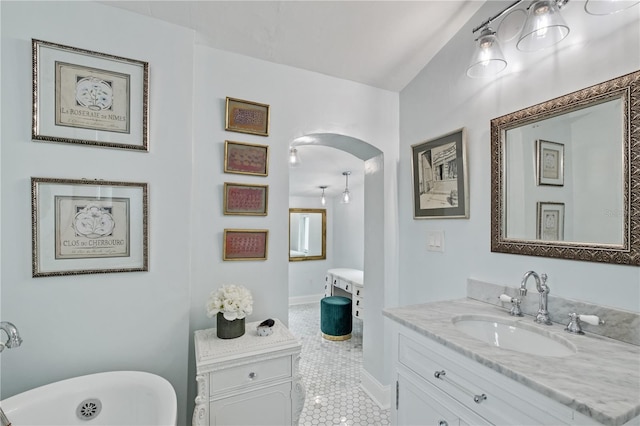 6010 17th Ave S, Gulfport, FL 33707 - bathroom with vanity, tile patterned floors, and a tub to relax in