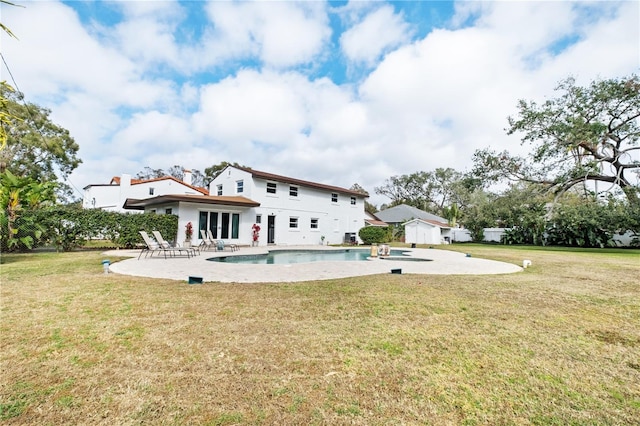 6010 17th Ave S, Gulfport, FL 33707 - back of house with a yard and a patio
