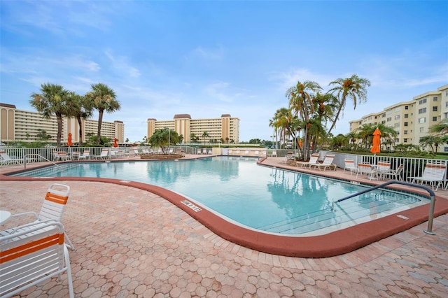 view of swimming pool featuring a patio area