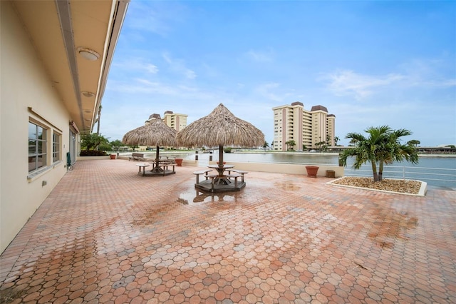 view of patio / terrace with a water view and a gazebo