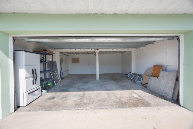 garage with white fridge