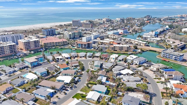 drone / aerial view with a water view and a beach view