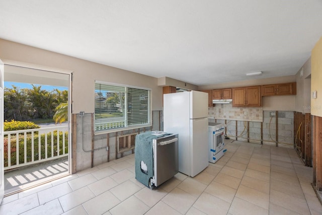 kitchen featuring white appliances and light tile patterned floors