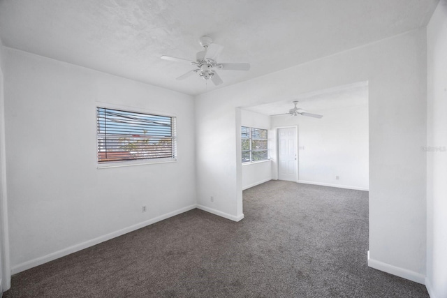 carpeted empty room with ceiling fan