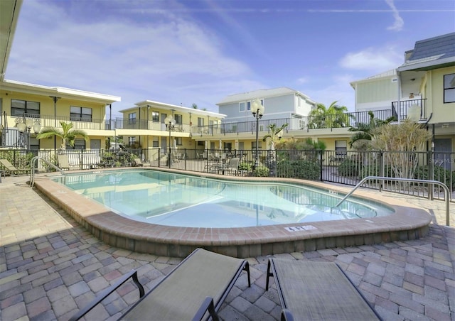 view of pool featuring a patio