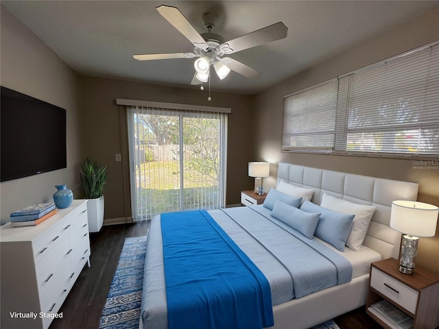 bedroom featuring dark wood-type flooring, access to outside, and ceiling fan