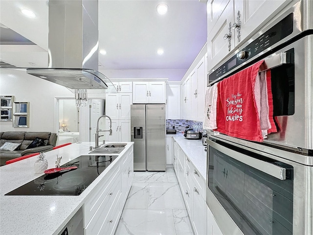 3911 Auburndale Ave, Orlando, FL 32839 - kitchen with white cabinetry, sink, island exhaust hood, light stone counters, and stainless steel appliances