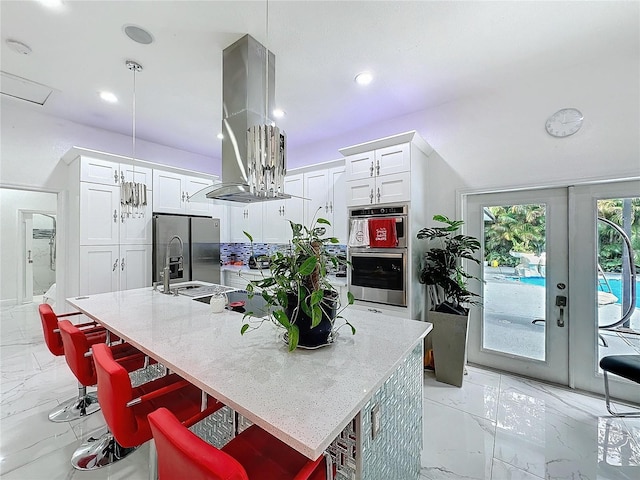 3911 Auburndale Ave, Orlando, FL 32839 - kitchen with island exhaust hood, a center island with sink, and a kitchen bar