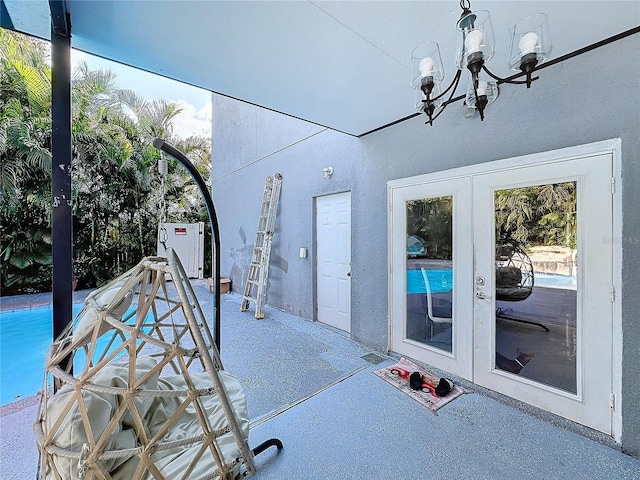 3911 Auburndale Ave, Orlando, FL 32839 - exterior space featuring an inviting chandelier and french doors
