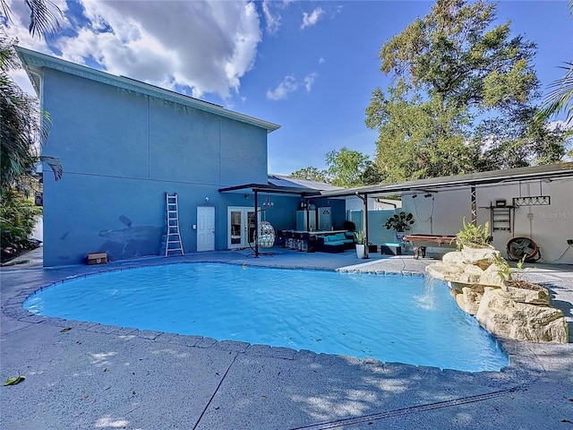 3911 Auburndale Ave, Orlando, FL 32839 - view of pool with pool water feature, a hot tub, and a patio area
