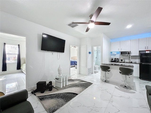 3911 Auburndale Ave, Orlando, FL 32839 - living room featuring ceiling fan