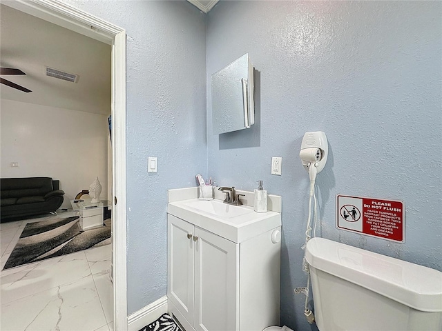 3911 Auburndale Ave, Orlando, FL 32839 - bathroom with ceiling fan, vanity, and toilet