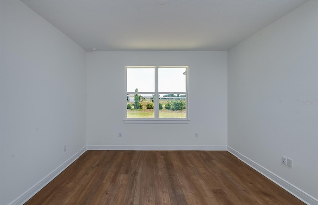 5295 SW 87th Ter, Ocala, FL 34481 - empty room with dark wood finished floors and baseboards