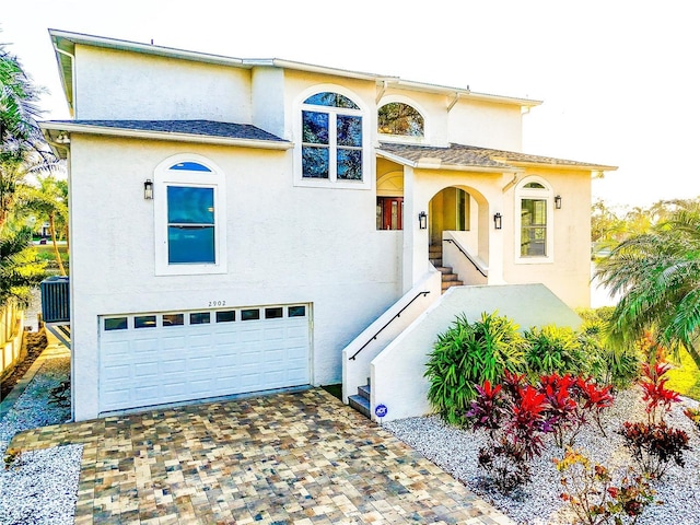 mediterranean / spanish-style house with a garage