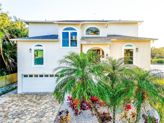 mediterranean / spanish-style home featuring a garage