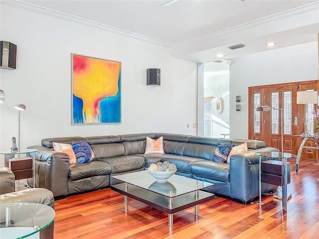 living room featuring ornamental molding and hardwood / wood-style floors