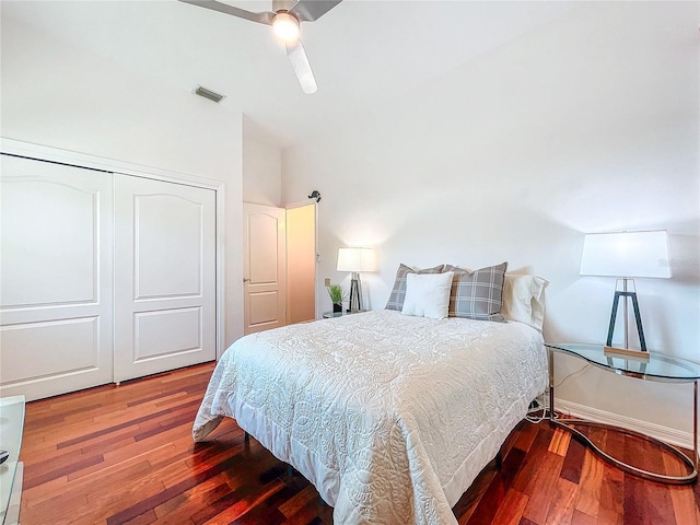 bedroom with ceiling fan, hardwood / wood-style floors, and a closet