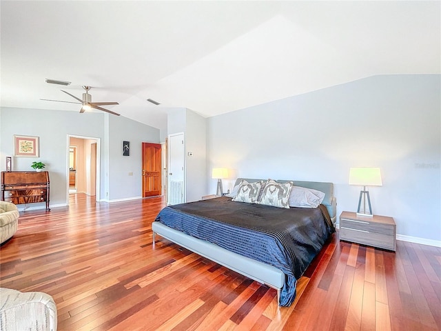 bedroom with lofted ceiling, hardwood / wood-style flooring, and ceiling fan